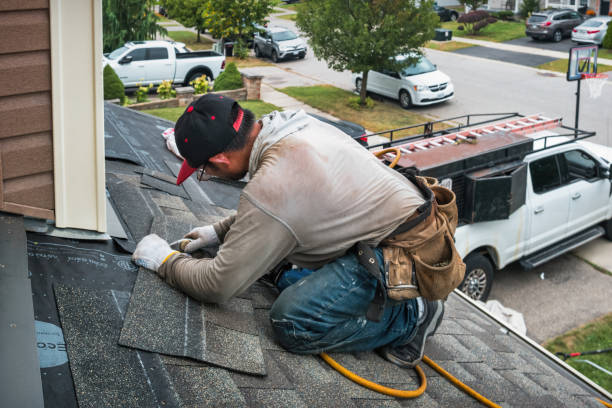 Professional Roofing technician working in Islip Terrace, NY